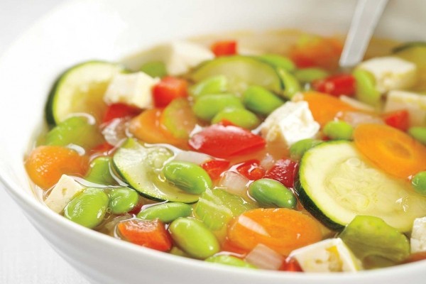 Edamame vegetable soup with wasabi cream