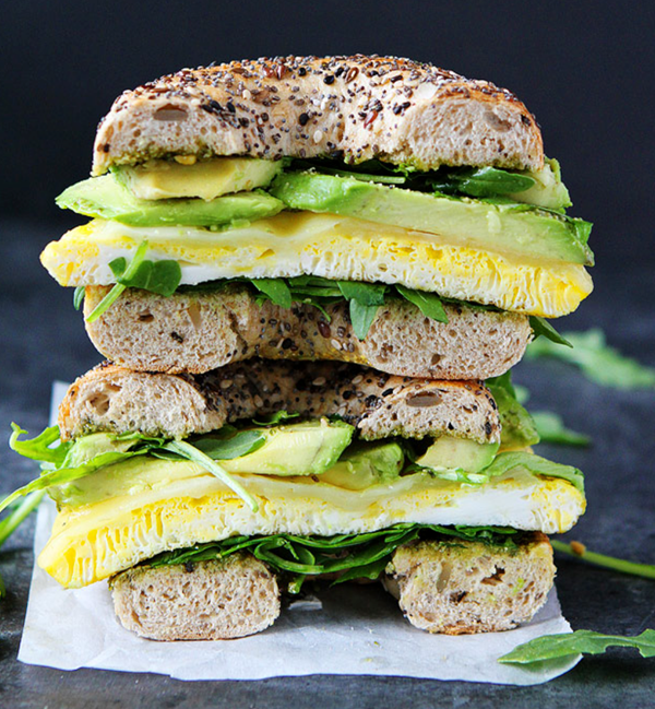 Egg, avocado, and pesto bagel sandwich