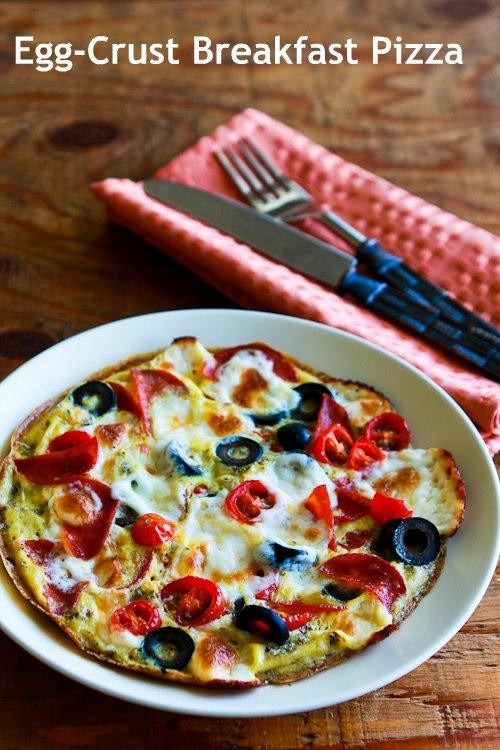 Eggcrust breakfast pizza with pepperoni, olives, mozzarella, and