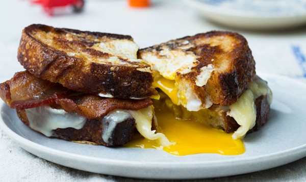 Egg-in-a-hole sandwich with bacon and cheddar