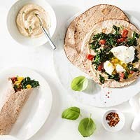 Egg, kale, and tomato breakfast wraps with hummus