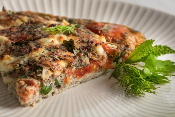Egg white frittata with roasted tomatoes, feta, and fresh herbs