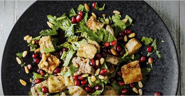 Eggplant and pomegranate salad with toasted pine nuts