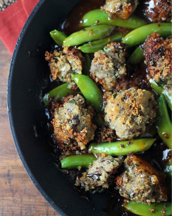 Eggplant “meatballs” and sugar snap peas in a toasted sesame sauce