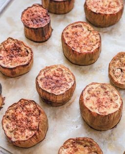 Eggplant steaks with roasted cherry tomatoes, pine nuts & soubise