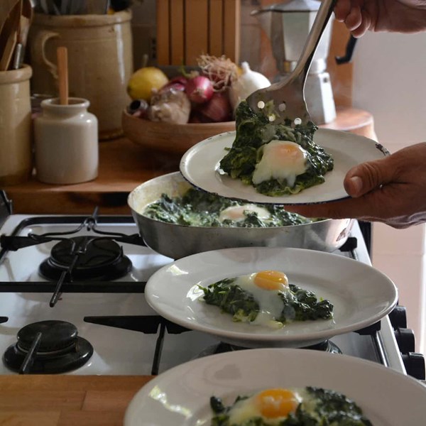 Eggs baked in greens