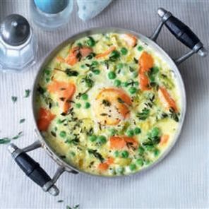Eggs en cocotte with hot-smoked salmon, leeks and peas