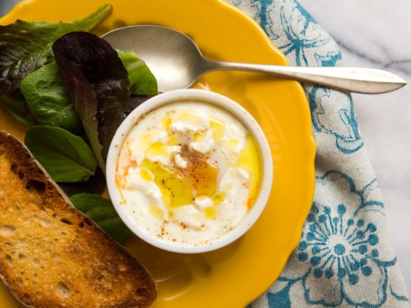 Eggs en cocotte with tomato and goat cheese