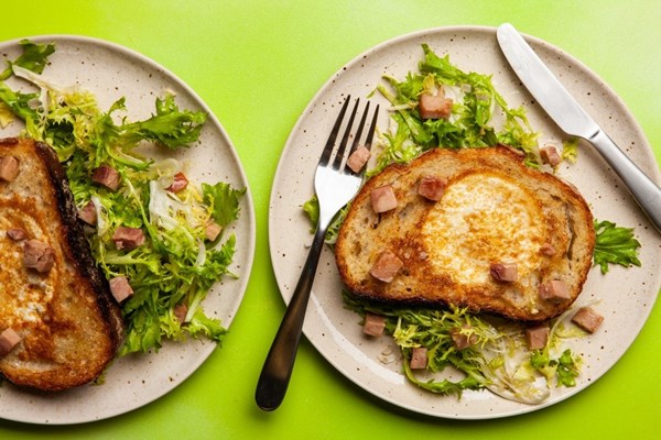 Eggs in a hole with frisee salad