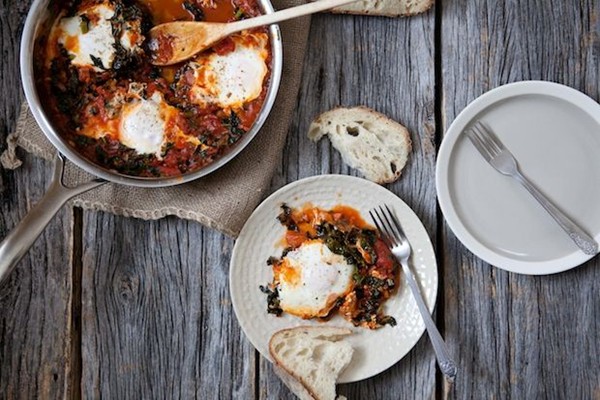 Eggs in a wintry kale and tomato sauce