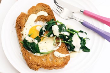 Eggs in bread and wilted spinach and Hollandaise