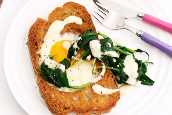 Eggs in bread with wilted spinach and Hollandaise