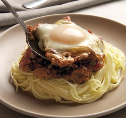 Eggs in puttanesca sauce with angel hair pasta