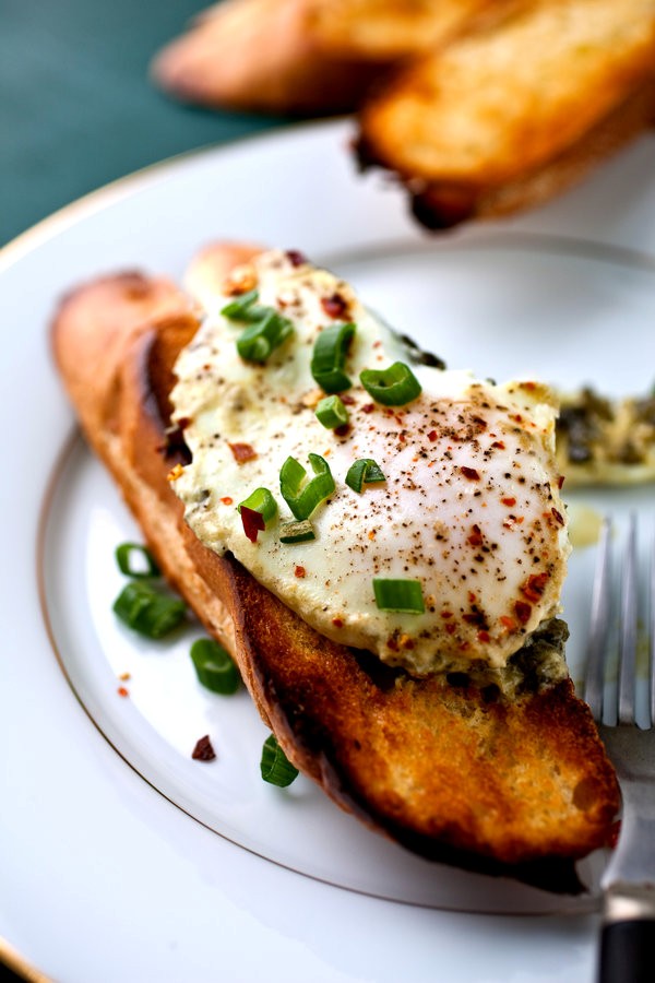 Eggs poached in buttery sorrel sauce