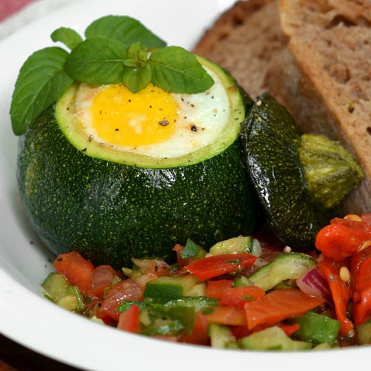 Eight-ball zucchini with eggs baked inside