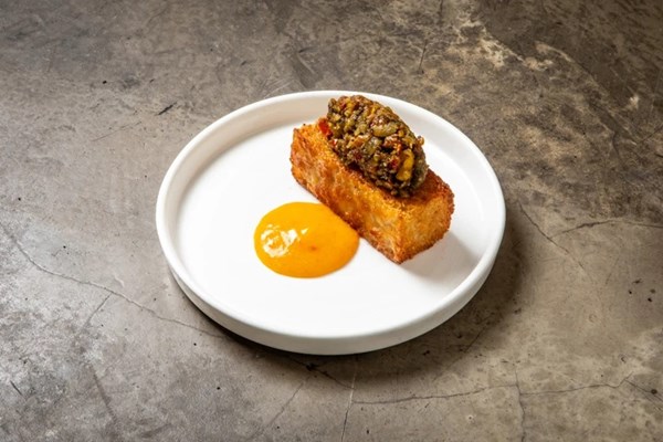 Ekuru with pumpkin seed pestou and Scotch bonnet sauce