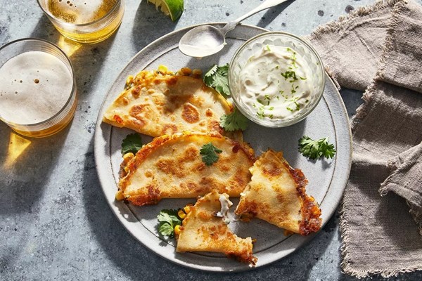 Elote-style quesadillas [lime & cumin crema]