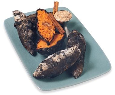 Ember-roasted sweet potatoes with maple-cinnamon butter