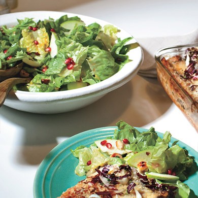 Escarole and butter lettuce salad with pomegranate seeds and hazelnuts