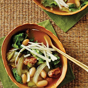 Escarole, bean, and sausage soup with Parmesan cheese