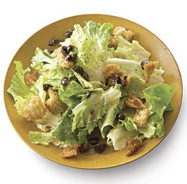 Escarole salad with olives, garlic croutons and lamb chops