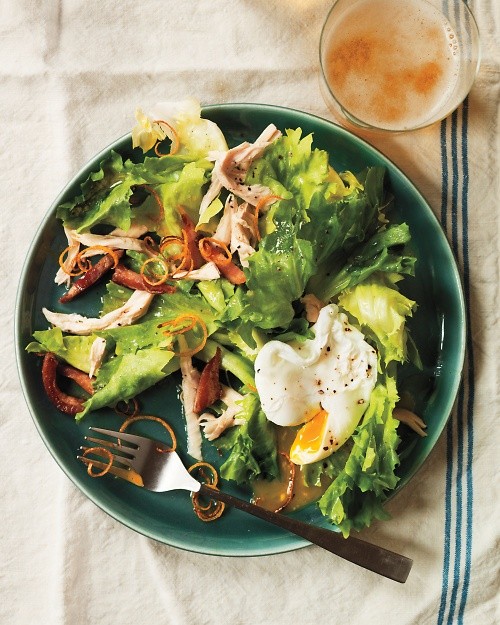 Escarole salad with roast lemon chicken, lardons, and poached eggs