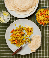 Ethiopian tikil gomen with yeasted pancakes