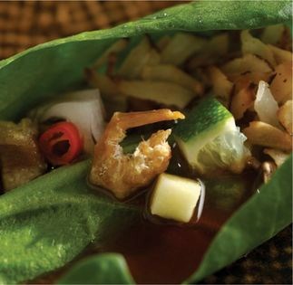Explosively flavored savory bites in wild pepper leaves (Miang khum)