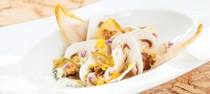 Extra-dry champignons, endive, and umami crème with grated, smoked, and frozen egg yolks and Roquefort