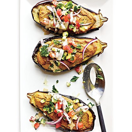Falafel-stuffed eggplant with tahini sauce and tomato relish