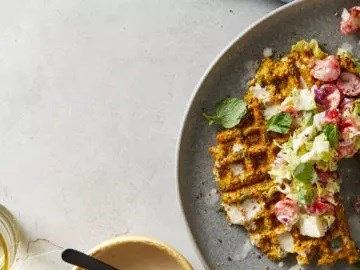 Falafel waffles with tomato salad and tahini sauce