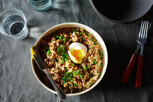 Farro risotto with sausage, mushroom, peas, and a poached egg