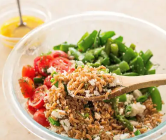 Farro salad with asparagus, snap peas, and tomatoes