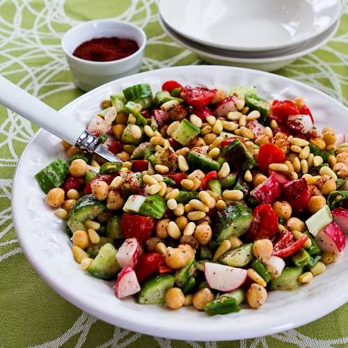 Fattoush-inspired chopped salad with tahini-buttermilk dressing, chickpeas, sumac, and pine nuts