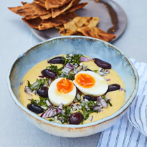 Fava bean puree, boiled egg, red onion, olives and parsley with crispbread
