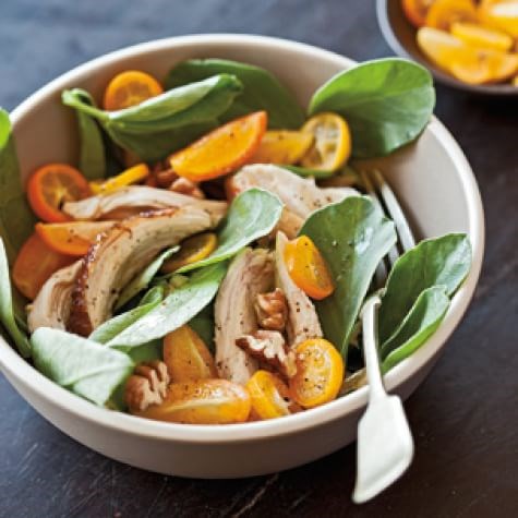 Fava greens with chicken, pecans & kumquats