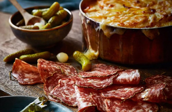 Fennel, potato & Gruyère gratin with charcuterie and pickles