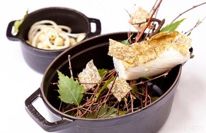 Fennel-smoked Alaska black cod with warm bean salad