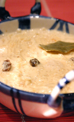 Festive rice pudding with cinnamon and raisins (Payesh)