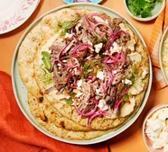 Feta & walnut-crusted Easter lamb with pomegranate