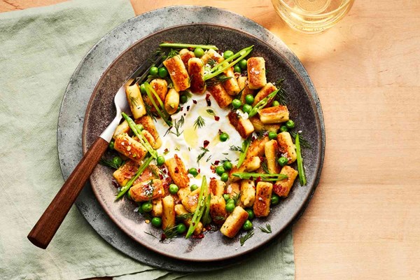 Feta cheese gnocchi with lemony yogurt and spring peas