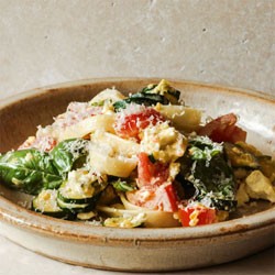 Fettuccine with saffron, zucchini, goat's cheese, tomatoes and basil