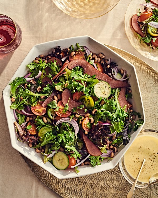 Field greens, poached pear, and black-eyed pea salad with citrus vinaigrette