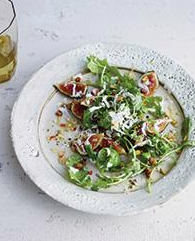 Fig and arugula salad with grated frozen Gorgonzola piccante