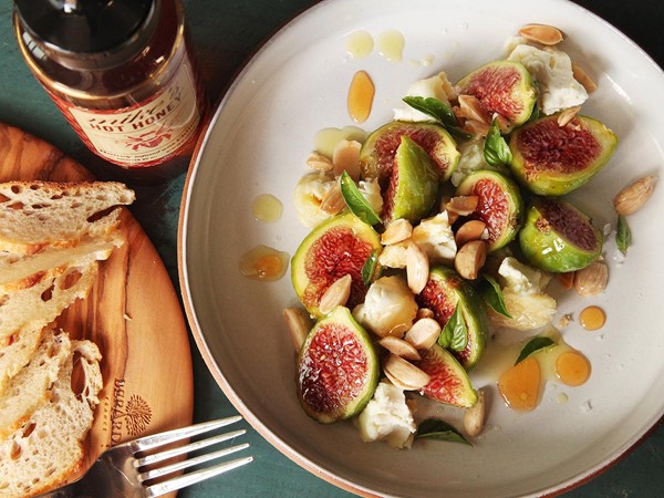 Figs with Marcona almonds, aged goat cheese, and hot honey
