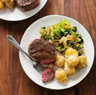 Filet mignon with pecorino potatoes and escarole