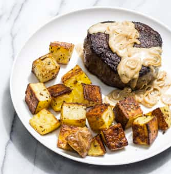 Filets mignons with rosemary potatoes and bourbon cream sauce