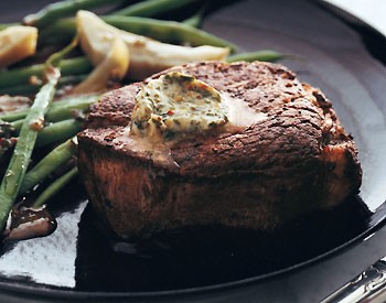 Filets mignons with spiced butter, glazed artichokes, and haricots verts
