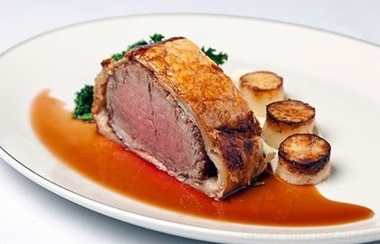 Fillet of beef Wellington with parsley root purée mini fondants, sautéed kale and rosemary jus