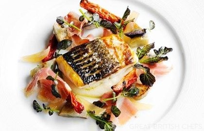 Fillet of sea bass with Parma ham, sauté artichokes and watercress